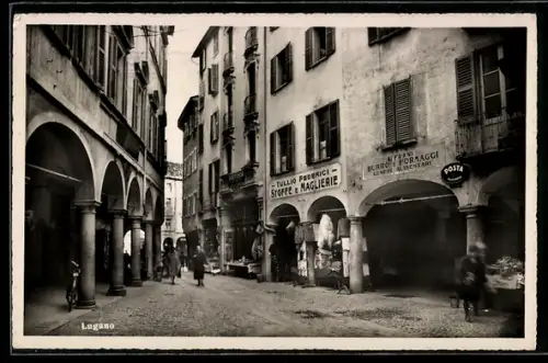 AK Lugano, Strassenpartie mit Geschäften, Stoffe e Maglierie