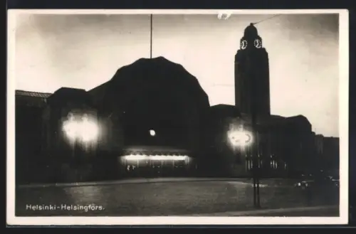 AK Helsinki, Bahnhof in der Dämmerung