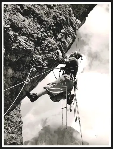 Fotografie Kletterer an einem Felsen