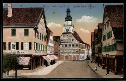 AK Kirchheim u. T., Strassenpartie beim Rathaus mit Geschäft