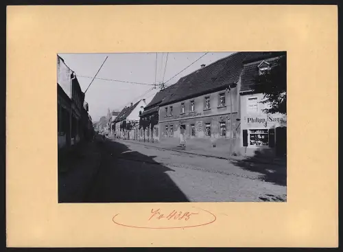 Fotografie Brück & Sohn, Meissen, Ansicht Strehla, Hauptstrasse Gasthaus Zum Deutschen Haus & Laden Philipp Saga