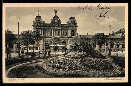 AK Mainz, Blumenbepflanztes Rondell vor dem Bahnhof