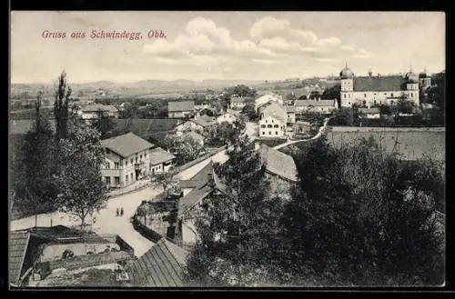 AK Schwindegg / Obb., Teilansicht mit Strassenpartie mit Häusern und Kirche