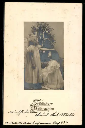AK Weihnachtsengel segnet ein Kind am Christbaum