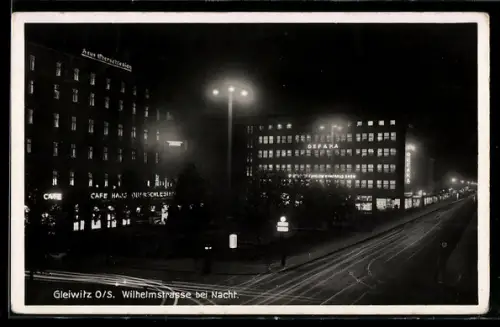AK Gleiwitz, Wilhelmstrasse mit Café Haus Oberschlesien bei Nacht