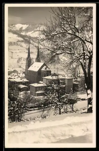 AK St. Johann i. Pong., Wintersportplatz mit Kirche im Schnee