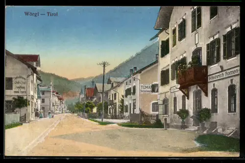 AK Wörgl /Tirol, Strassenpartie mit Geschäftshaus Heinrich Romen