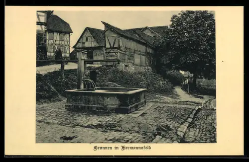 AK Hermannsfeld, Ortspartie mit Brunnen