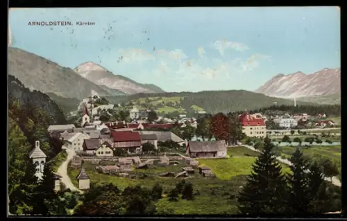 AK Arnoldstein /Kärnten, Gesamtansicht mit Kirche und Bergen
