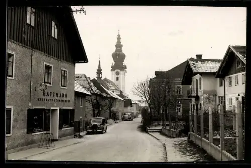 AK Kallham, Strassenpartie mit Kaufhaus Hatzmann im Winter