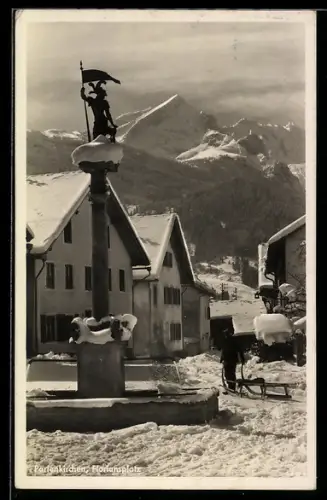 AK Partenkirchen, Floriansplatz mit Brunnen im Schnee