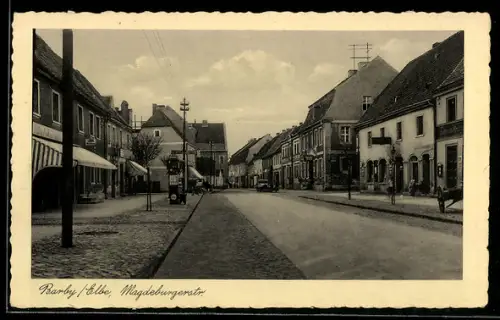 AK Barby /Elbe, Magdeburgerstrasse mit Geschäft von Heinrich Krüger