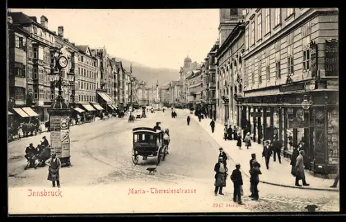 AK Innsbruck, Maria-Theresienstrasse mit Geschäften und Standuhr