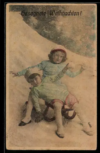 AK Zwei Kinder im Schnee auf einem Schlitten