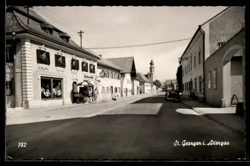 AK St. Georgen i. Attergau, Strassenpartie mit Cafe und Kirche
