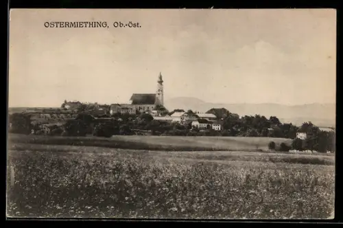 AK Ostermiething /Ob.-Öst., Teilansicht mit Kirche