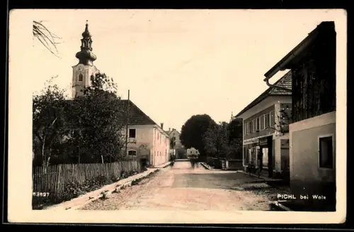 AK Pichl bei Wels, Strassenpartie mit Geschäft und Kirche