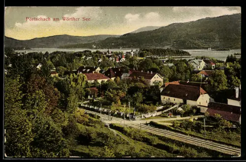 AK Pörtschach am Wörther See, Panorama mit See und Bahngleisen