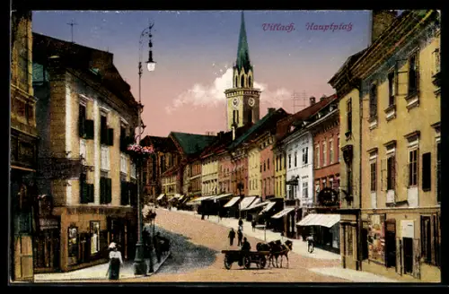 AK Villach, Hauptplatz mit Geschäften und Kirchturm
