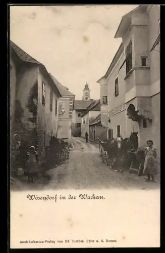 AK Wösendorf in der Wachau, Strassenpartie mit Kirche