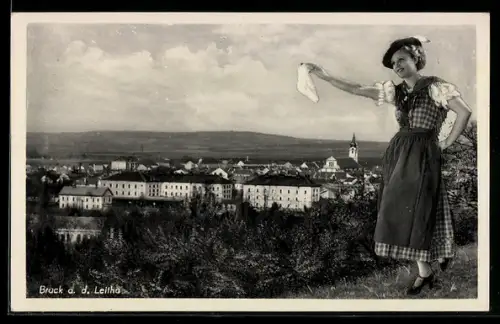 AK Bruck a. d. Leitha, Panorama mit Frau in Tracht und Kirchturm