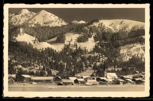 AK Bayrischzell, Teilansicht mit Kirche im Schnee