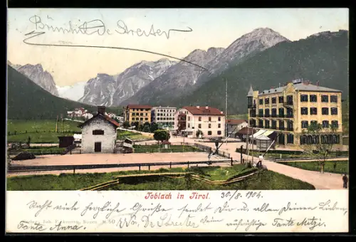 AK Toblach, Veduta del paese con montagne sullo sfondo