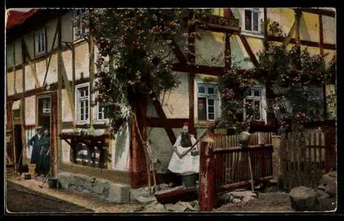 AK Schwalm, Familie vor ihrem Heim