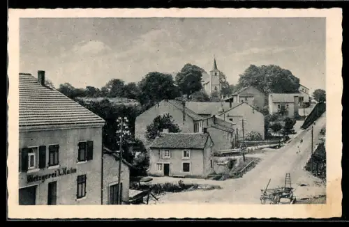 AK Ittersdorf bei Wallerfangen, Metzgerei J. Hahn, Dorfstrasse, Kirche