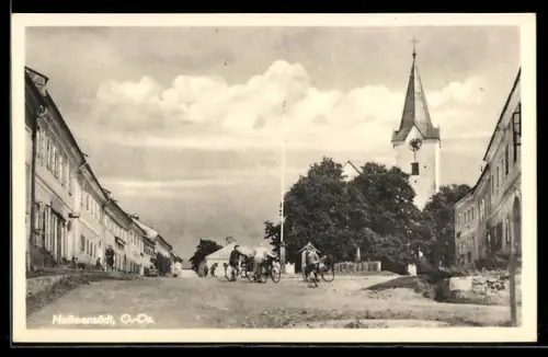AK Hellmonsödt, Strassenpartie mit Blick zur Kirche