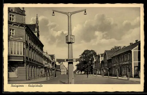 AK Skaisgirren, Partie in der Hauptstrasse mit Schildern Richtung Insterburg und Tilsit