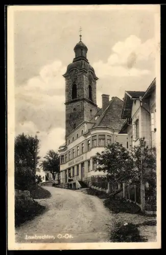 AK Lambrechten /O.-Oe., Geschäft von Hans Desch und Kirche