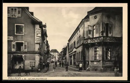 AK Müllheim i. B., Wilhelmstrasse mit Geschäft