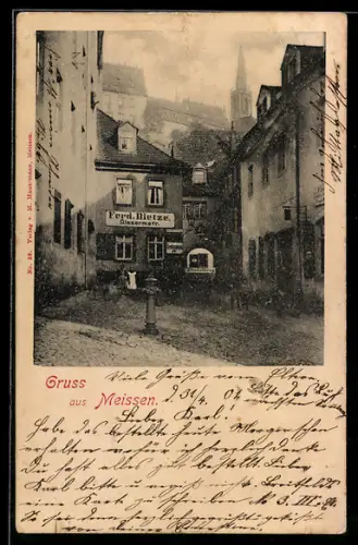 AK Meissen, Strassenpartie mit Geschäft von Ferd. Bietze, Baderberg 3