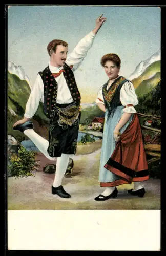 AK Bayerisches Pärchen in volkstypischen Trachten tanzen miteinander