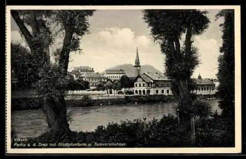 AK Villach, Partie an der Drau mit Stadtpfarrturm und Turnvereinshaus