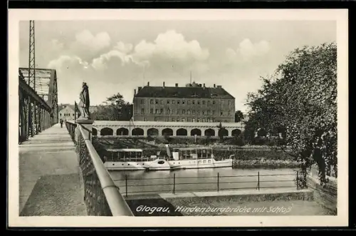 AK Glogau, Hindenburgbrücke mit Schloss und Statue