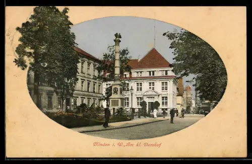 AK Minden i. W., Am kl. Domhof, Strassenpartie mit Säulendenkmal