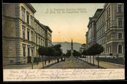 AK Villach, K. K. Staatsbahn Direktions-Gebäude mit Blick auf die evangelische Kirche