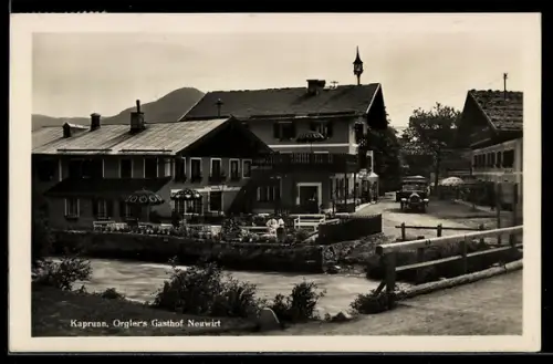 AK Kaprun, Orglers` Gasthof Neuwirt mit Flusspartie u. Strasse