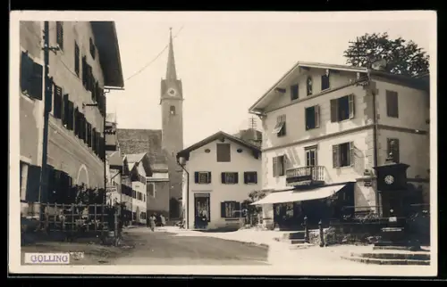 AK Golling, Strasse mit Häusern, Uhrtürmchen und Kirche