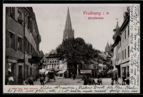 AK Freiburg i. B., Strassenpartie in Oberlinden mit Kirchturm
