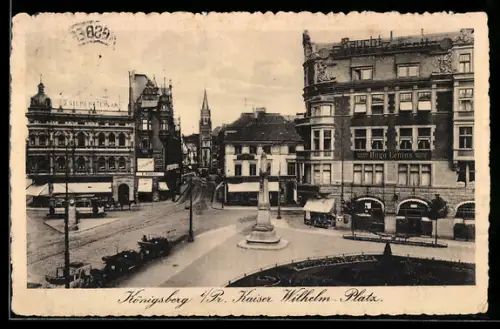 AK Königsberg i. Pr., Kaiser Wilhelm Platz mit Denkmal, Modewaren Hugo Lenius