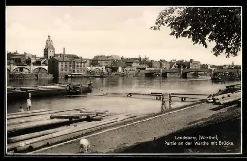AK Landsberg /Warthe, Partie an der Warthe mit Brücke