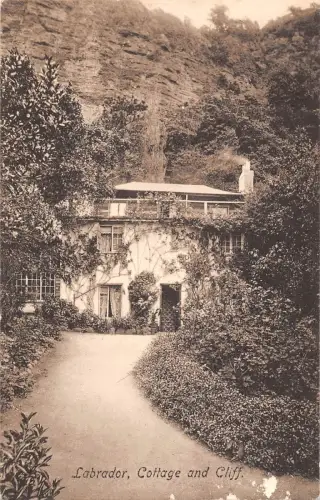 BR70227 Labrador Cottage and Cliff UK