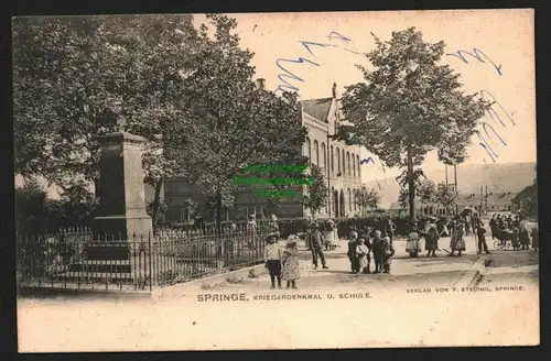 144054 AK Springe 1907 Kriegerdenkmal u. Schule Strasse