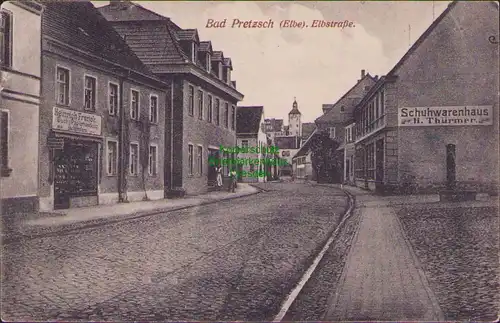 157548 AK Pretzsch Elbe 1912 Elbstr. Papierhandlung Buchbinderei Schuhwarenhaus