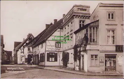 157038 AK Wolgast i. Pom Badstubenstraße 1939 Fotokarte Kolonialwaren Frisör