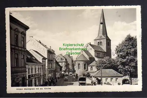 132271 AK Hilden Marktplatz mit ev. Kirche Metzgerei Tölsch 1950