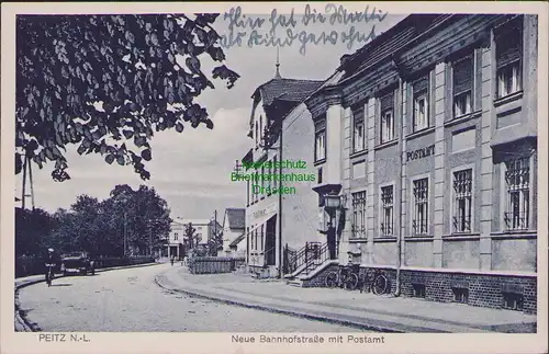 157837 AK Peitz N.-L. um 1920 Neue Bahnhofstraße mit Postamt
